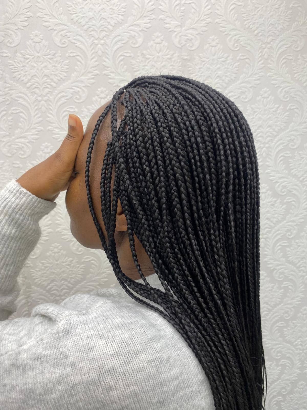 Box braids swept to one side