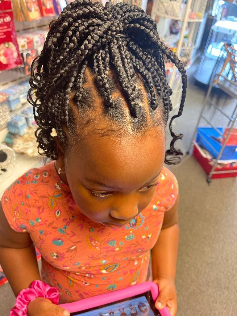 Young girl with boho braids and curly ends